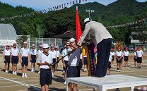 優勝旗返還